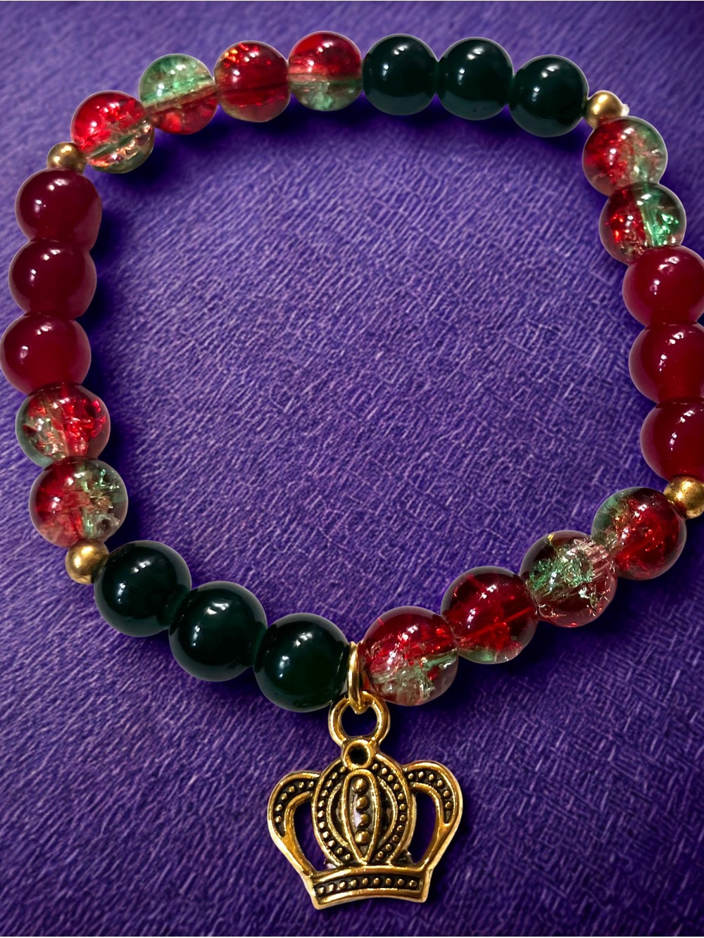 Gold crown charm/red and green glass beaded bracelet handcrafted
